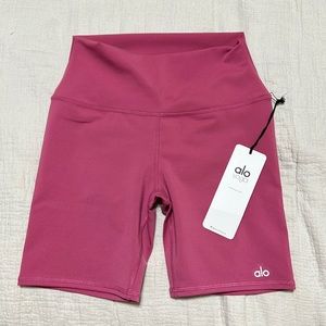 High-waist biker shorts in color raspberry sorbet.